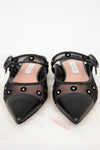 Black pointed-toe shoes with mesh design on a white background