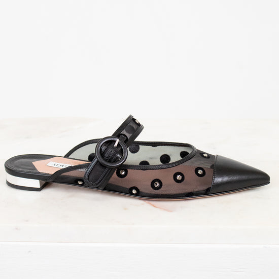 Black sandal with decorative elements on a white background